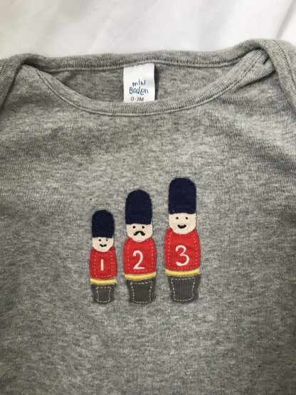 Newborn Queens Guards bodysuit by Mini Boden - Image 2