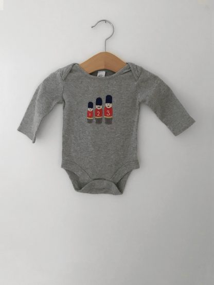Newborn Queens Guards bodysuit by Mini Boden